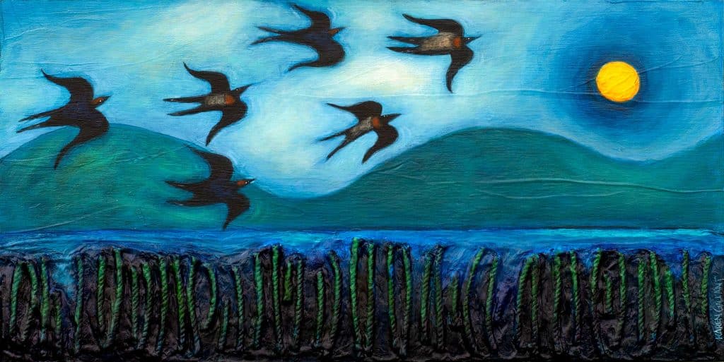 Swallow in the moonlight over a marsh. Dunes on the background